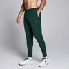 Męskie tkane joggery z kolekcji Training MP – Dark Emerald