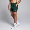 Męskie tkane spodenki o wewnętrznej długości nogawki 13 cm z kolekcji Training MP – Dark Emerald